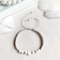 Bransoletka z serduszkiem z masy perłowej i z howlitem Pleciona makrama