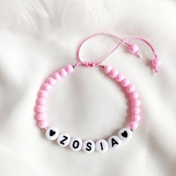 Bransoletka z imieniem dziecka z koralików różowa na sznurku dziecięca