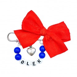 Broszka z imieniem dziecka z czerwoną kokardką granatowa